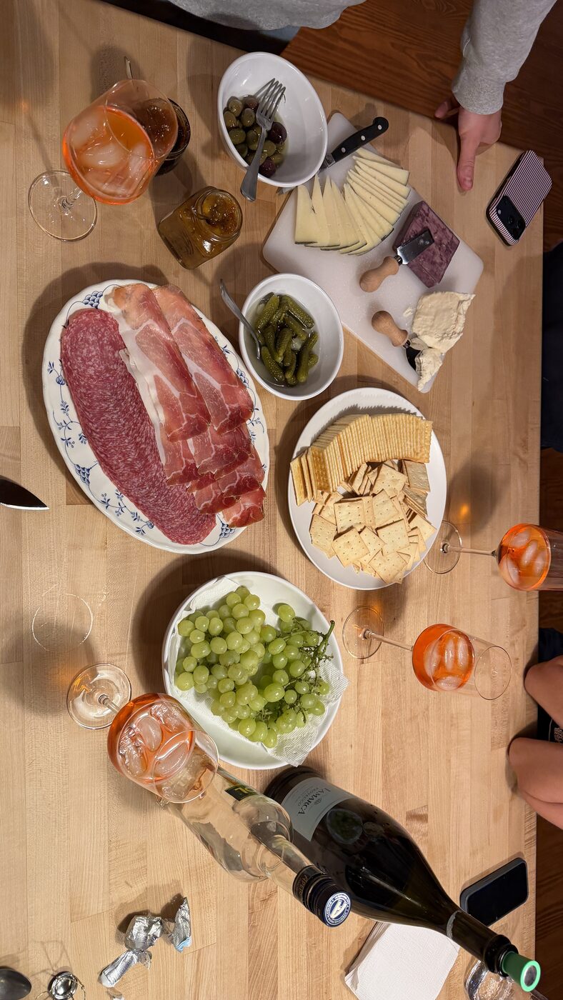 Overhead view of a charcuterie spread with drinks
